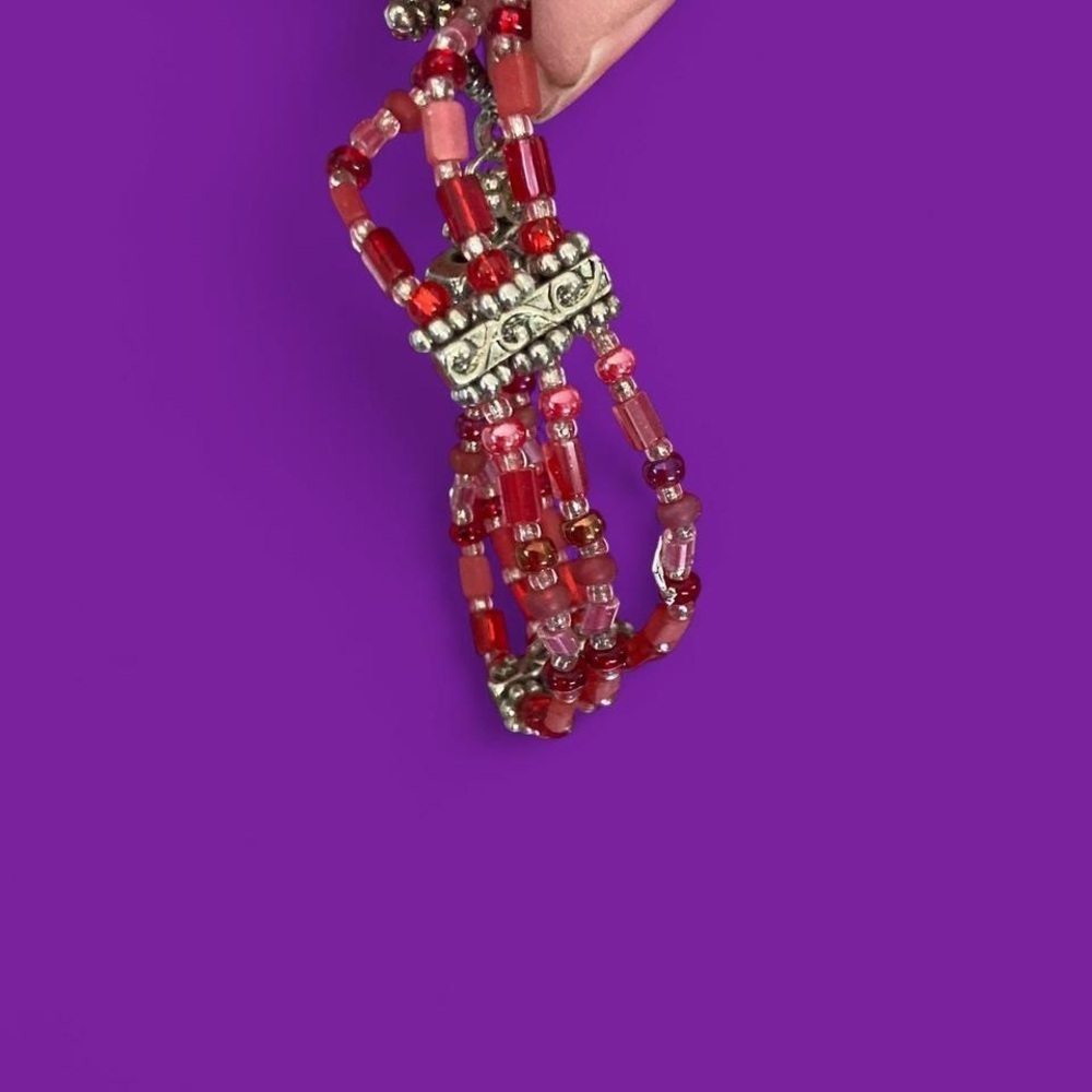 Red beaded bracelet with silver details